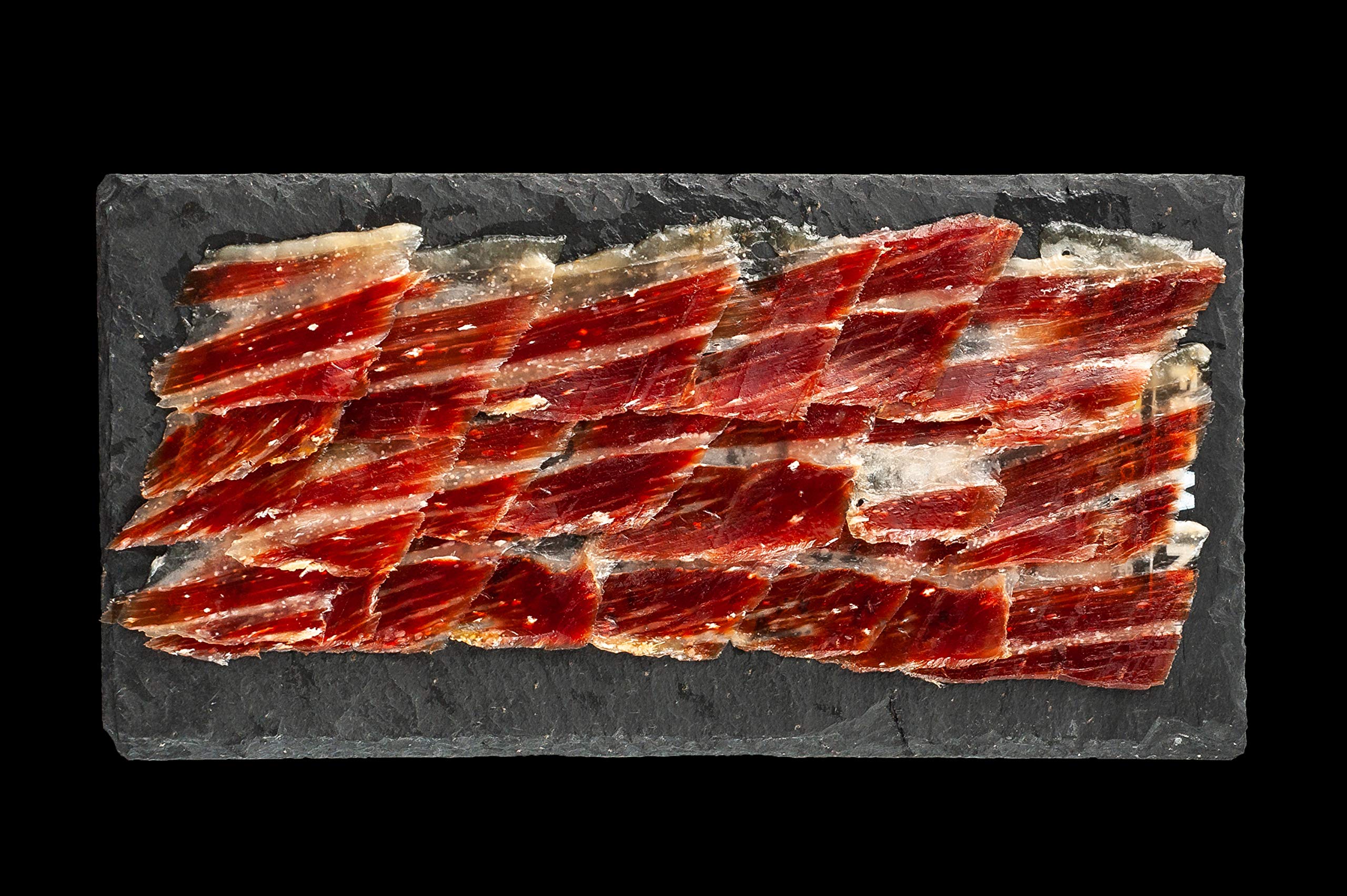 a Jamon diplay over a slate board